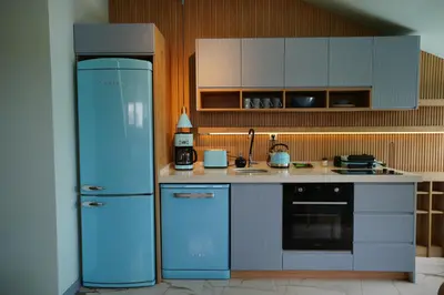 a kitchen with a blue refrigerator and a sink at Vanilla 11 in Istanbul