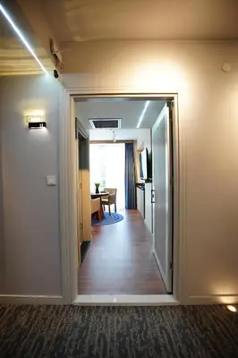 a hallway with a door leading to a dining room at Vanilla 11 in Istanbul