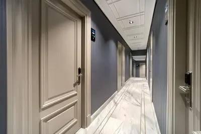 an empty corridor with a door in a building at Union Hotel Plat Inn -Special Category in Istanbul