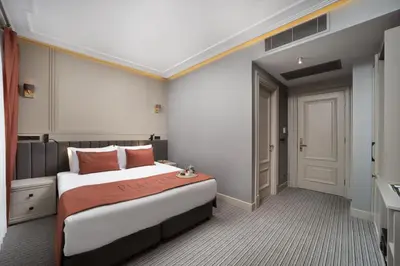 a hotel room with a bed and a door at Union Hotel Plat Inn -Special Category in Istanbul