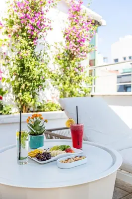 a white table with a tray of food and drinks at Bdino Boutique Hotel in Istanbul