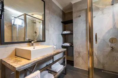 a bathroom with a sink and a shower at La Miel Şile in Sile
