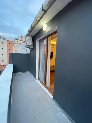 a balcony of a building with a sliding glass door at Taksim Nova homes in Istanbul