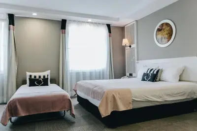 a hotel room with two beds and a window at Mia Berre Hotels in Istanbul