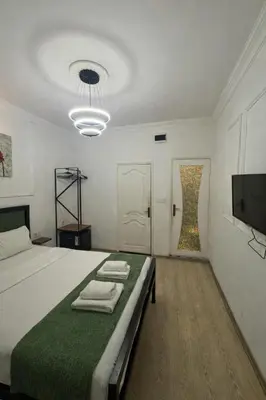 a bedroom with a large bed with towels on it at 24 BOUTİQUE HOTEL in Istanbul
