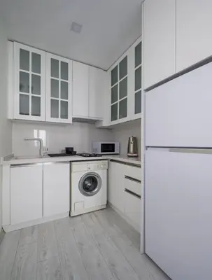 a kitchen with white cabinets and a washing machine at Private Modern 2BR1Bath Bebek Gem! #80 in Istanbul