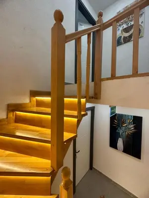 a staircase with wooden steps in a house at Aya Langa Guest House in Istanbul