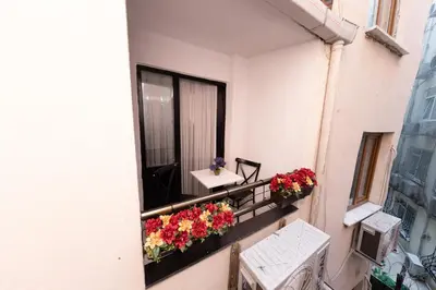 a balcony with flowers on a building at Aya Langa Guest House in Istanbul