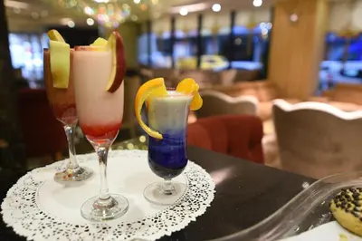 two cocktails in glasses sitting on a table at MidMar Deluxe Hotel in Istanbul