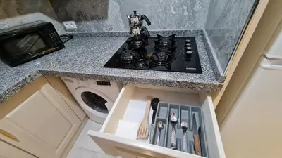 a kitchen with a stove top in a counter at Cozy Spacious near Green Mosque in Yıldırım