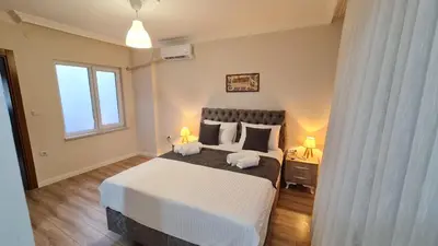 a bedroom with a large bed and a window at Cozy Spacious near Green Mosque in Yıldırım