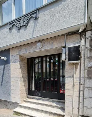 a door to a building with stairs in front at Cozy Spacious near Green Mosque in Yıldırım