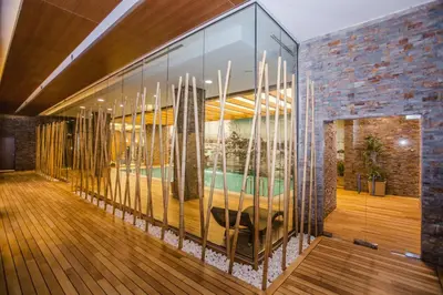 a lobby with a glass wall with a table in it at Gorrion Hotel Istanbul in Istanbul