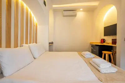 a hotel room with a bed with two towels on it at Emir Hotel in Istanbul