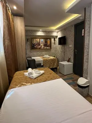 a hotel room with a bed and a bathroom at Peker Hotel in Istanbul