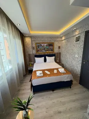 a bedroom with a large bed in a room at Peker Hotel in Istanbul