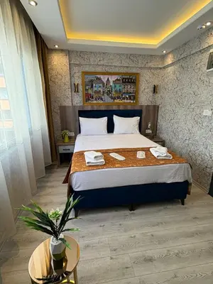 a bedroom with a large bed in a room at Peker Hotel in Istanbul
