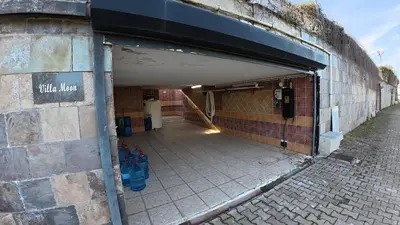 a brick building with a walkway through a tunnel at Villa Moon in Gebze