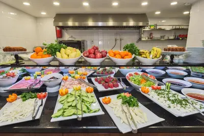 a buffet with many different fruits and vegetables on plates at Darkmen Hotel 2 in Istanbul