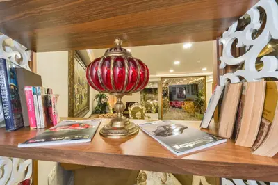 a table with books and a red lamp on it at Darkmen Hotel 2 in Istanbul