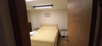a small bedroom with a bed and a light at Coskun House in Istanbul
