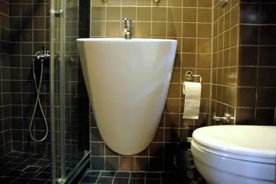a bathroom with a toilet and a sink and a shower at Sinem Hotel & Old City in Istanbul