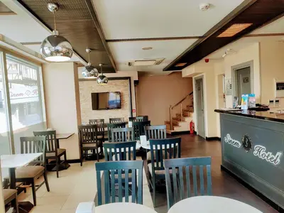 a restaurant with chairs and tables and a bar at Sinem Hotel & Old City in Istanbul