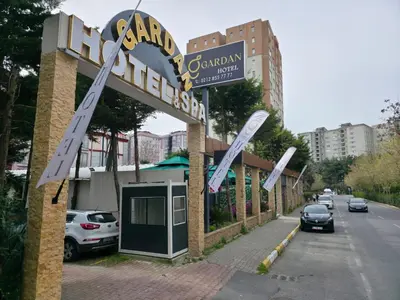 a sign for a restaurant on the side of a street at Gardan Hotel in Beylikduzu