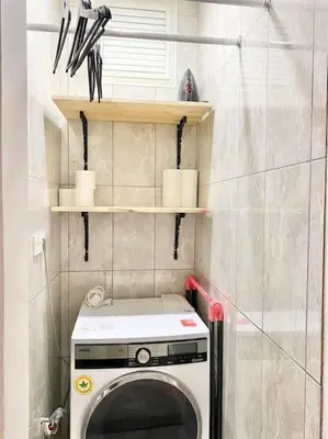 a small bathroom with a washing machine in it at K&Y Apartments in Taksim 2 in Istanbul