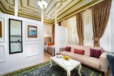 a living room with a couch and a table at Alhambra Apart Hotel in Istanbul