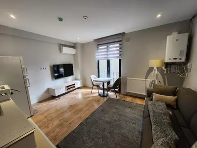 a living room with a couch and a table at Remta Real Estate in Istanbul