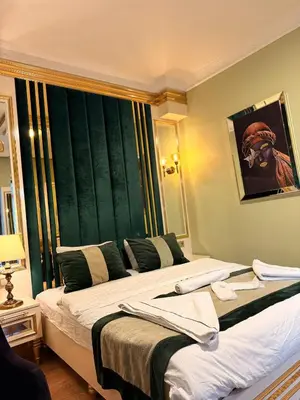 a hotel room with two beds and a window at Whıte Moon Hotel Suites in Istanbul