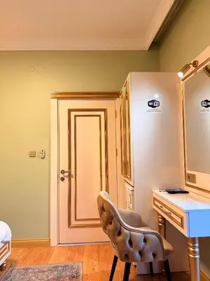 a room with a desk and a chair and a sink at Whıte Moon Hotel Suites in Istanbul