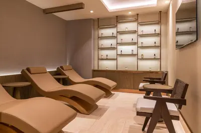 a waiting room with a row of chairs and tables at Orient Occident Hotel Istanbul, Autograph Collection in Istanbul