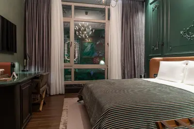 a bedroom with a bed and a window at Orient Occident Hotel Istanbul, Autograph Collection in Istanbul