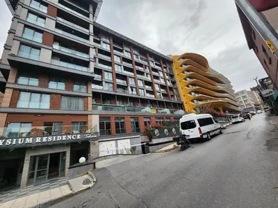 a white van parked in front of a building at TAKSiM PERFECT RESiDENCE, 3 BEDROOMS, 140 M2, POOL GYM SAUNA ACCESS in Istanbul