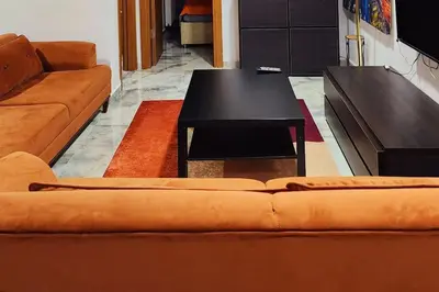 a living room with a couch and a coffee table at Taksim Square Residence, Two bedrooms, pool sauna gym in Istanbul