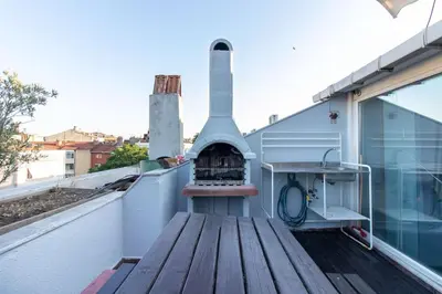an outdoor fireplace on the roof of a building at Exclusive Vibrant 3BR Duplex w Terrace in Kadıköy! in Istanbul