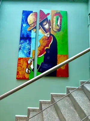 two pieces of art on the side of a building at Cosy flat nearTaksim/Nişantaşi in Istanbul
