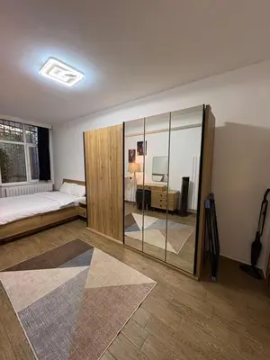 a bedroom with a bed and a desk in it at Cosy flat nearTaksim/Nişantaşi in Istanbul