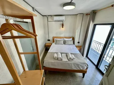 a small bedroom with a bed with two pillows on it at Elegance House Hotel in Istanbul