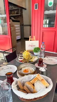 a table with plates of food and bread on it at Elegance House Hotel in Istanbul