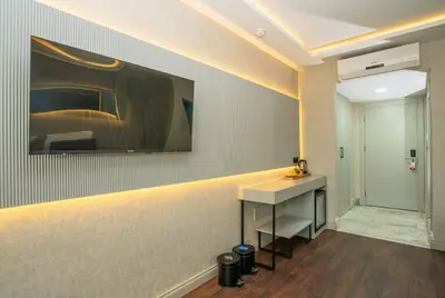 a room with a counter and a painting on the wall at 216 Station Suite Gebze in Gebze