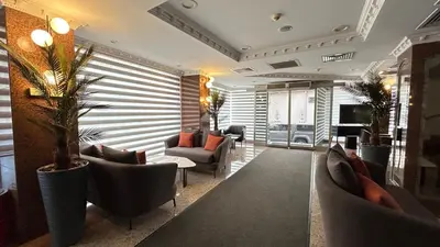 a lobby with couches and chairs in a room at Grand Hotel Seferoğlu in Istanbul