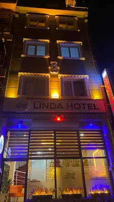 a hotel is lit up at night at Kadıköy Linda Hotel in Istanbul