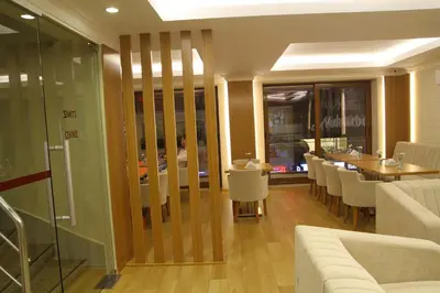 a restaurant with a dining room with tables and chairs at Besiktas Otel in Istanbul