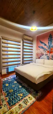 a bedroom with a large bed and a rug at Dimora Hotel Kadıköy in Istanbul