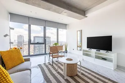 a living room with a tv and a couch at Scenic Bright Studio w Parking, PoolViews! #302 in Istanbul
