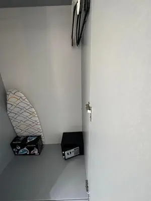 a door in a room with a shelf and a box at TAKSİM LARİSSA RESİDENCE in Istanbul