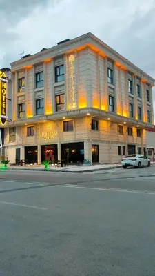 a large building with a car parked in front of it at Park Hotel & Private Transportation İstanbul Airport-By Loft in Arnavutköy